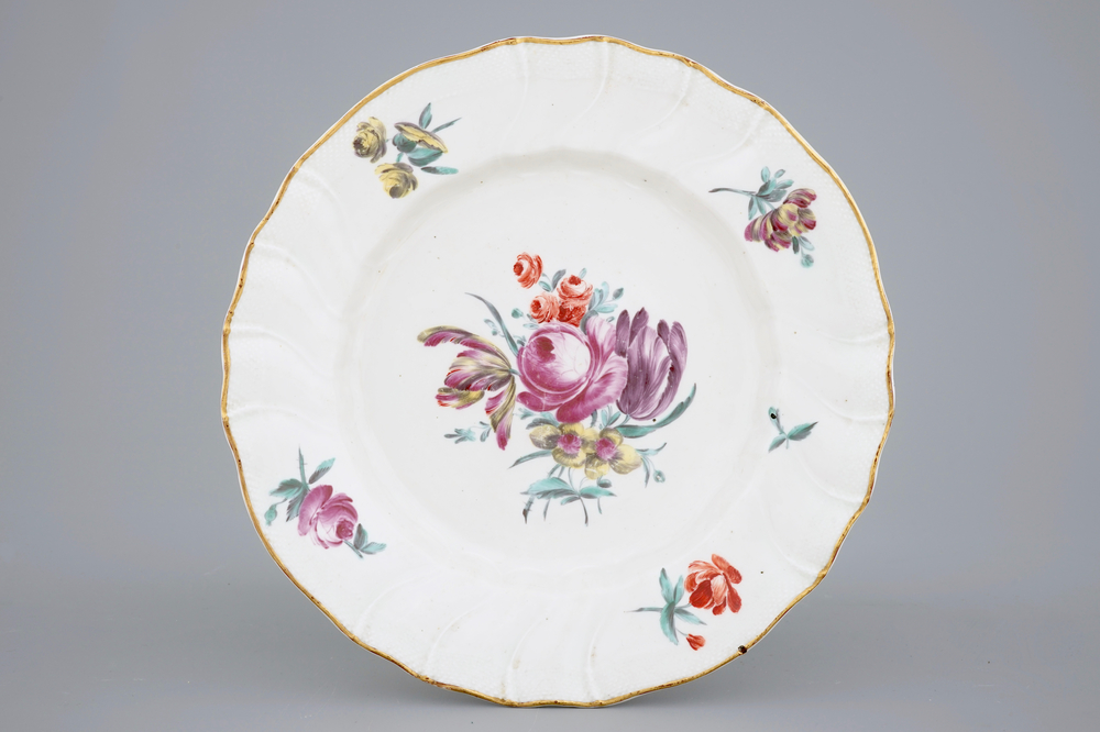 A polychrome Tournai porcelain plate with floral decoration, 18th C.