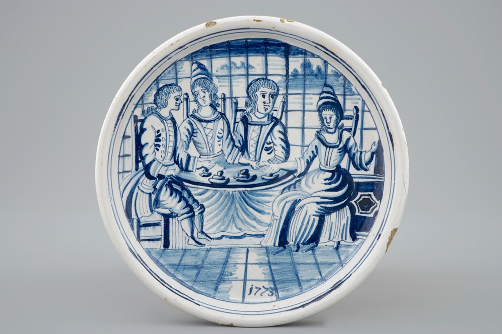 A dated blue and white salver with a tea drinking scene, Harlingen, Friesland, 1775