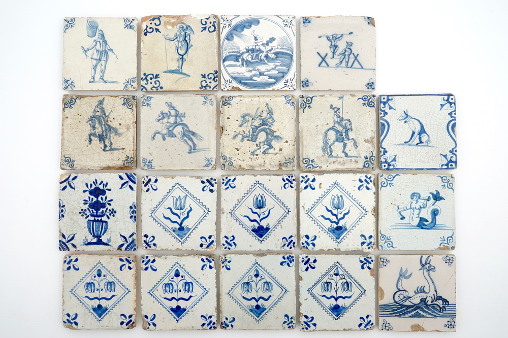 A set of 19 antique Dutch Delft blue and white tiles, 17/18th C.