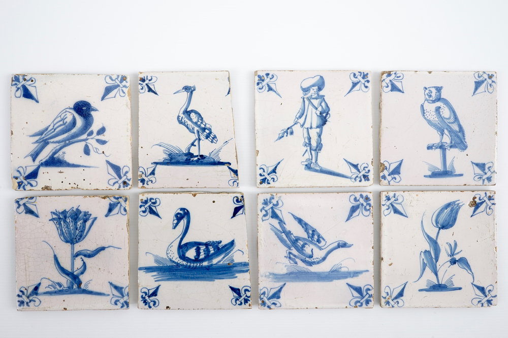 A set of 8 unusual blue and white Dutch Delft tiles, 18th C.