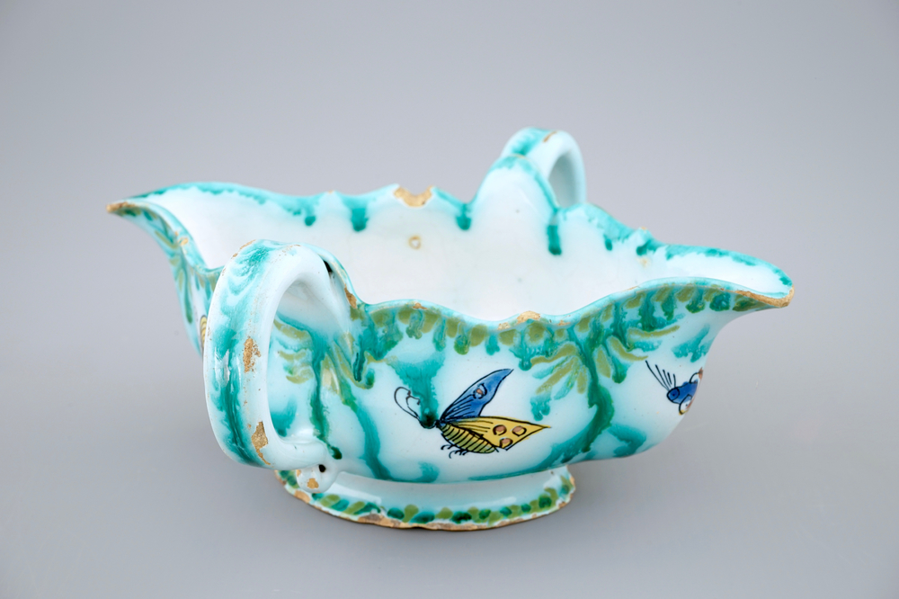 A Brussels faience sauce boat with butterflies and caterpillars, 18th C.