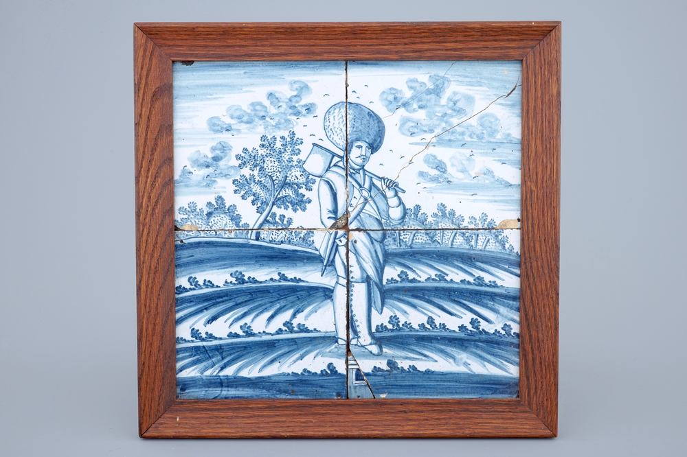 A Dutch Delft tile mural with a cussack with an axe, Harlingen, Friesland, 18th C.