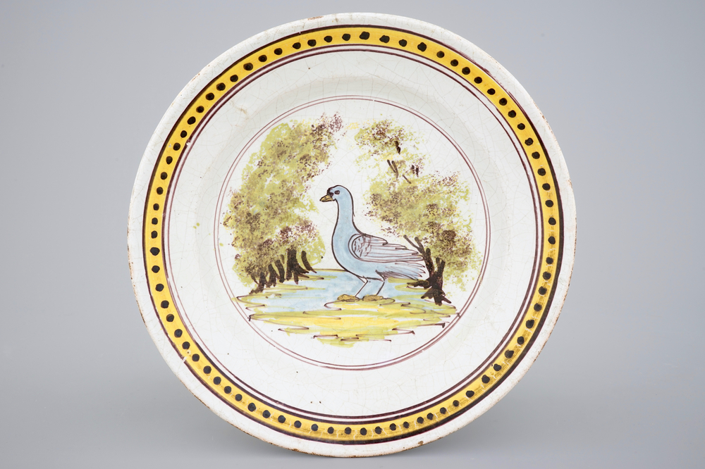 A Brussels faience dish with a bird, 18th C.