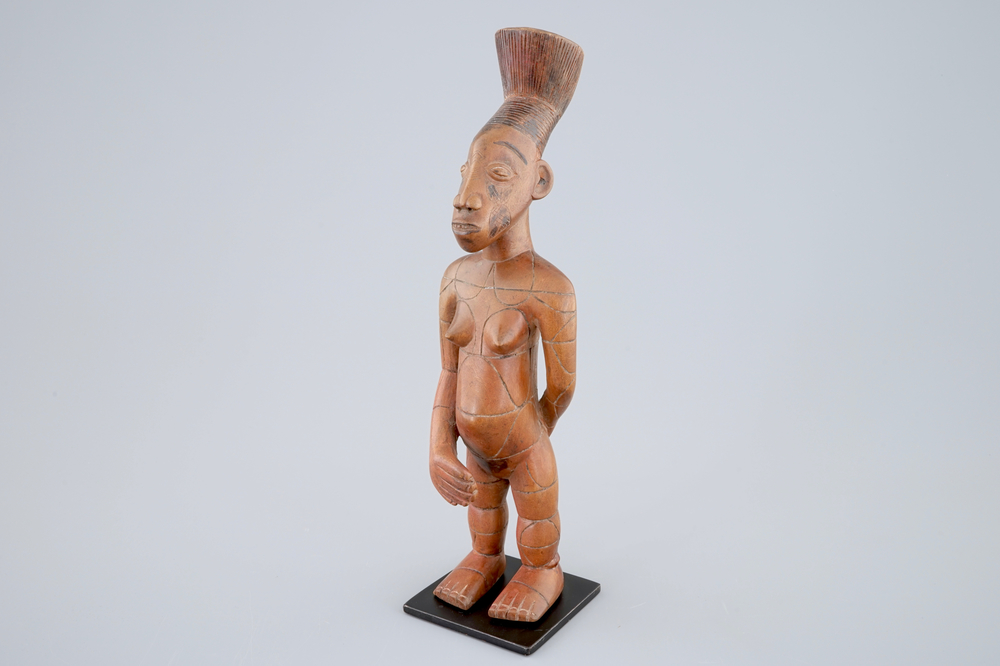 An African carved wood figure on stand, Mangbetu, Congo