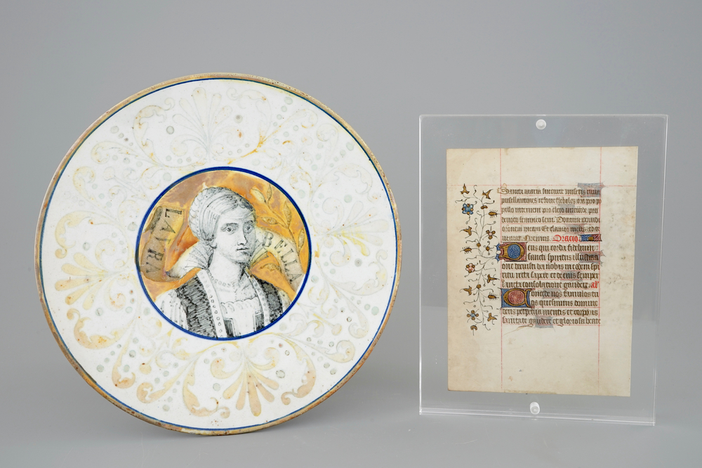 An Italian maiolica 'Bella Donna&quot; plate, 19th C. and a page from a Book of Hours, 13th C.