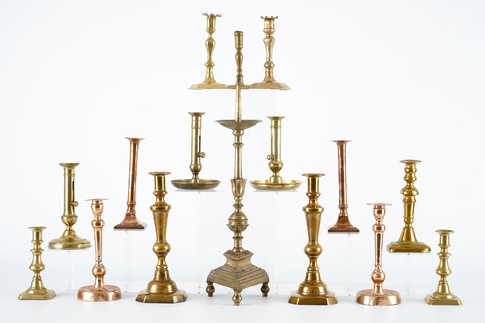 A set of 16 brass and bronze candlesticks, 17/19th C.
