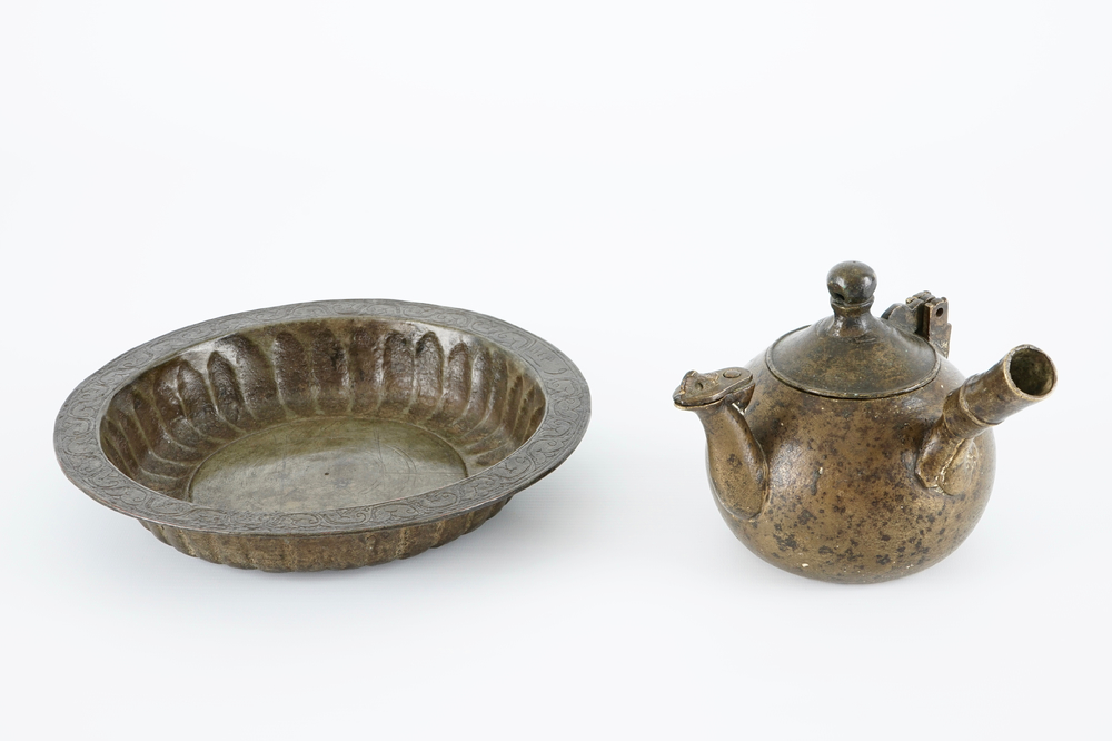An islamic brass basin and a bronze water pot, Northern Africa, 17/19th C.