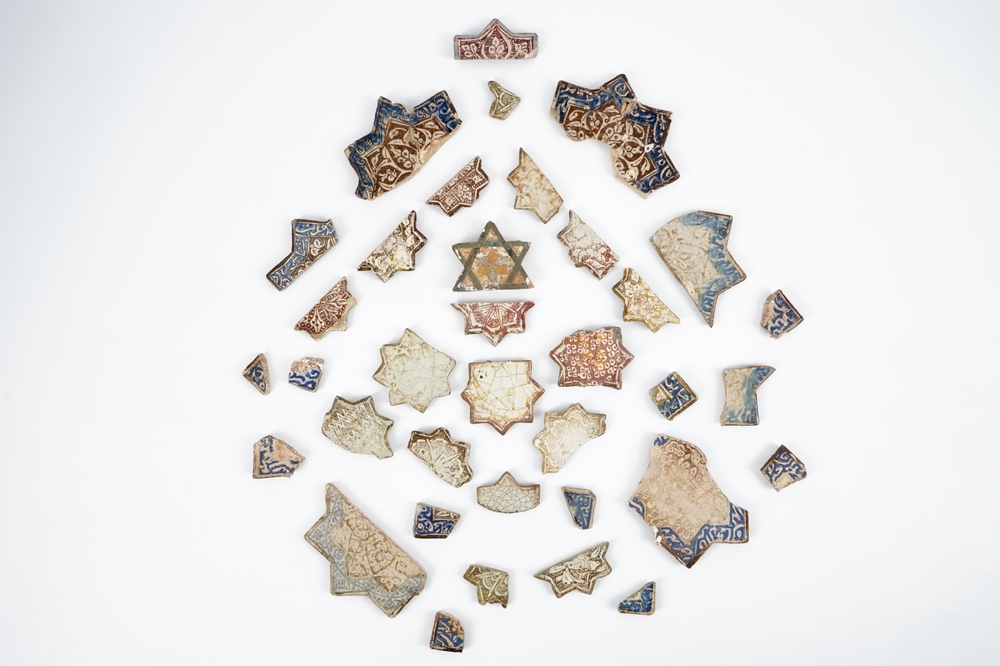 A large collection of Kashan star tile fragments, Central Persia, 13/14th C.