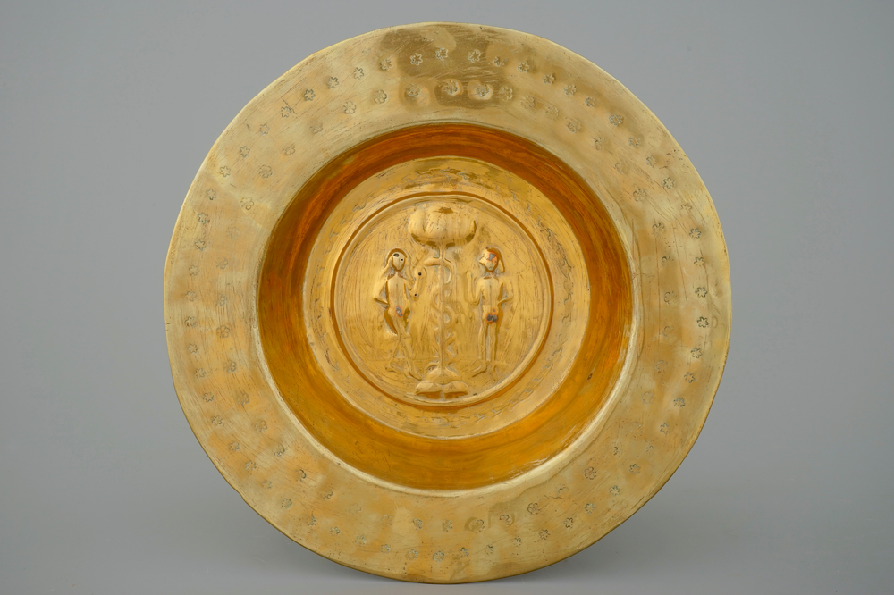 A large broad-rimmed brass alms bowl with Adam and Eve, N&uuml;rnberg, 15th C.