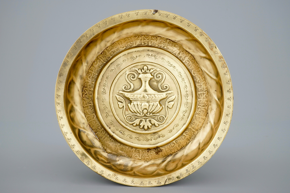 A Nuremberg brass alms bowl depicting a flowervase, 15/16th C.