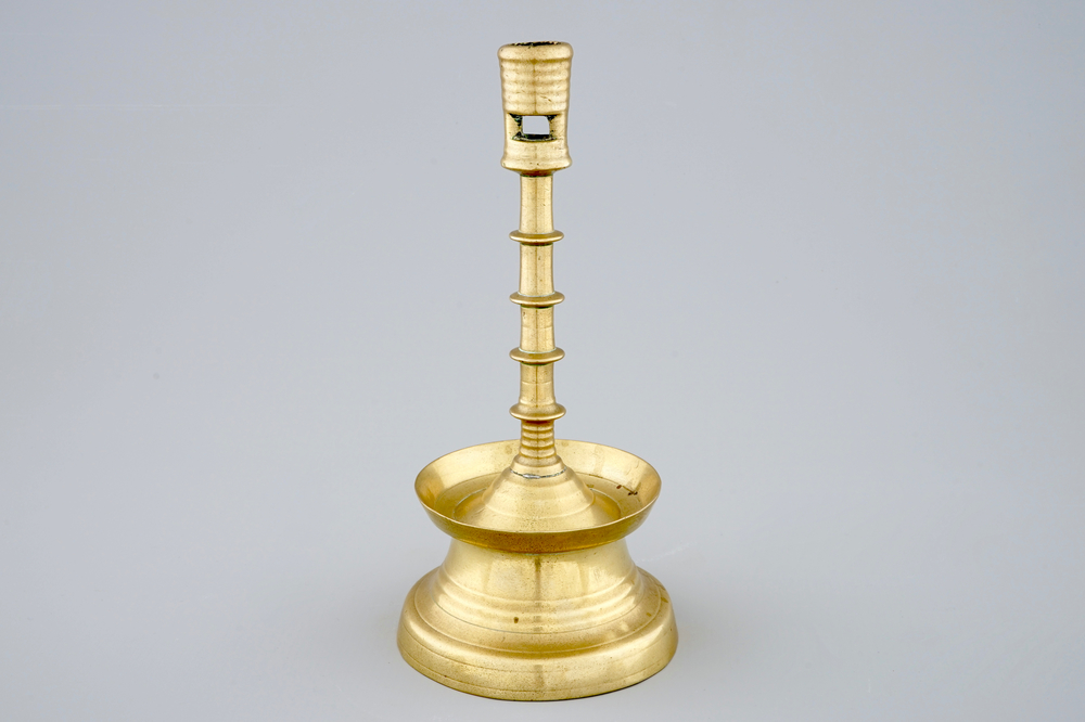 A copper alloy candle stick, The Low Countries, late 15th C.
