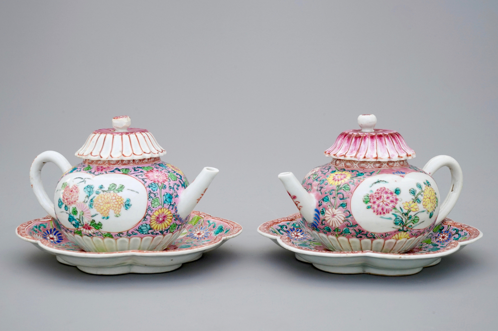 A pair of Chinese famille rose teapots on stand, Yongzheng/Qianlong, 18th C.