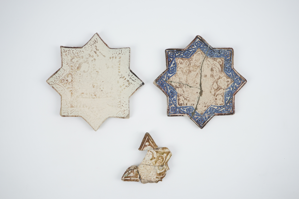 Two Kashan star shaped tiles and three fragments, Central Persia, 13/14th C.