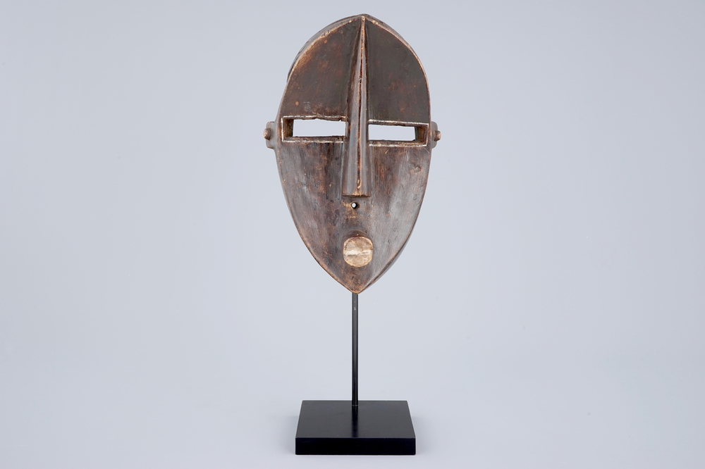 An African carved wooden mask, Lwalwa, Congo, early 20th C.