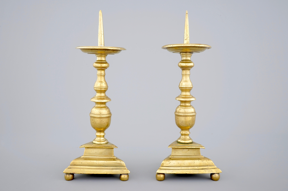 A pair of bronze pricket candle sticks, 17th C.