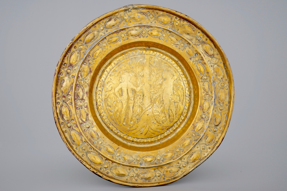 A large Flemish brass alms dish with Adam and Eve, Mechelen, 17e eeuw