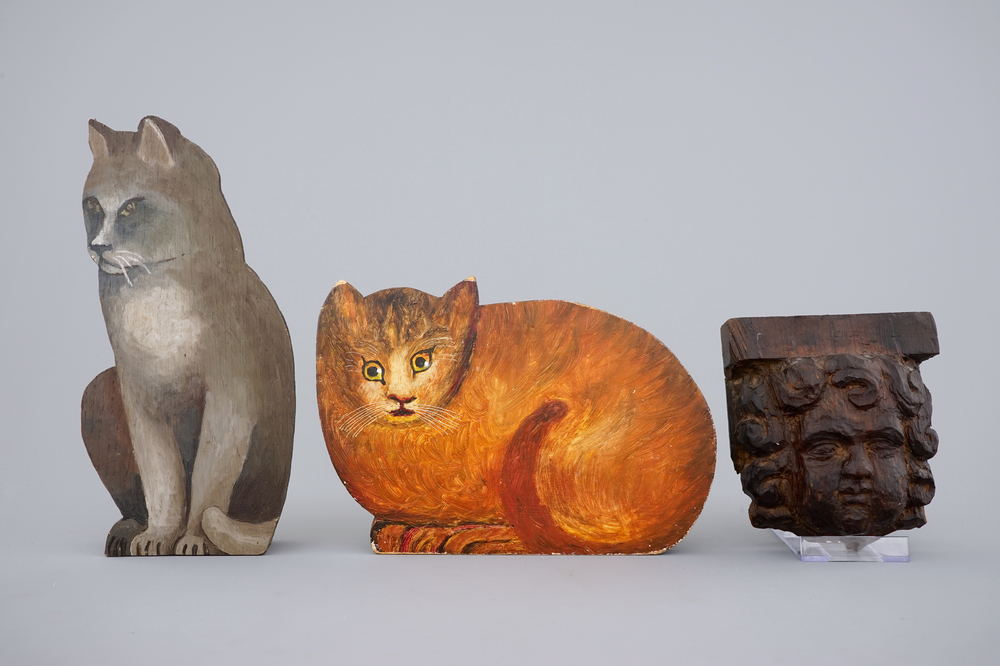An 18th C. carved wood cherub's head and two painted wood cats, 19/20th C.