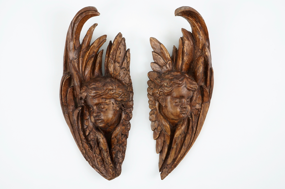 A pair of carved wood putto heads, 18th C.