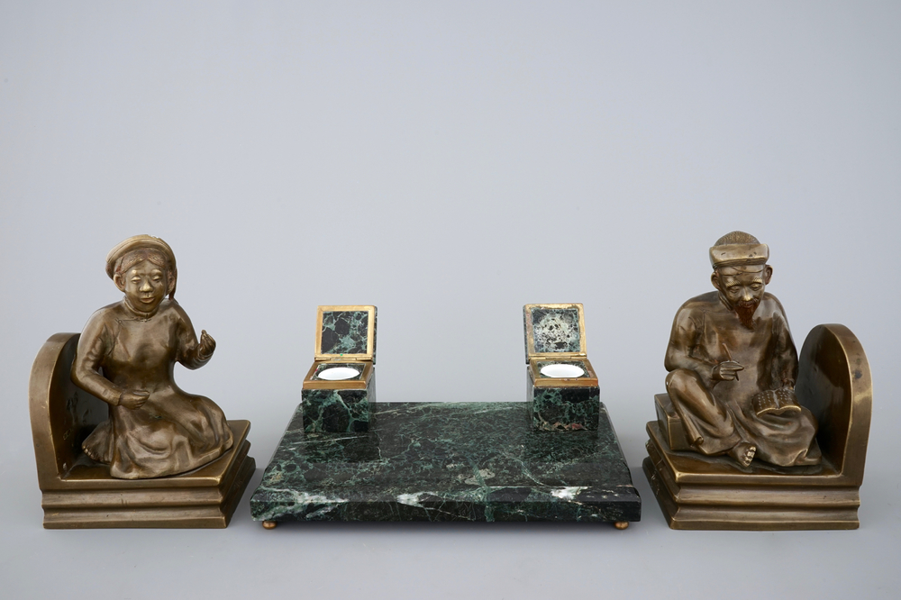 An art deco green marble inkwell and a pair of figurative book ends, 20th C.