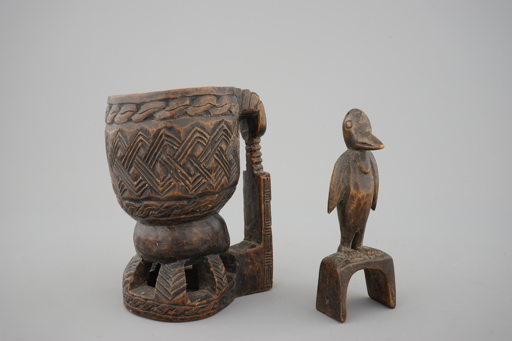 A carved wood Kuba cup and a zoomorph ornament, Congo, 20th C.