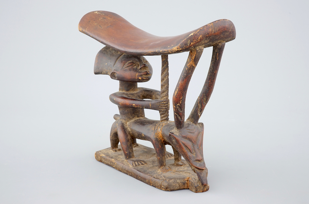 An African carved wood headrest pillow, 20th C.