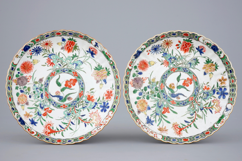 A pair of notched Chinese famille verte dishes with floral designs, Kangxi