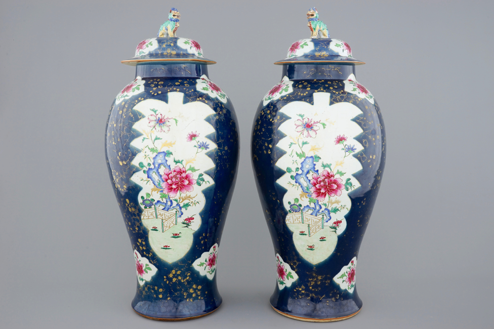 A tall pair of Chinese famille rose powder blue ground vases with covers, Qianlong, 18th C.