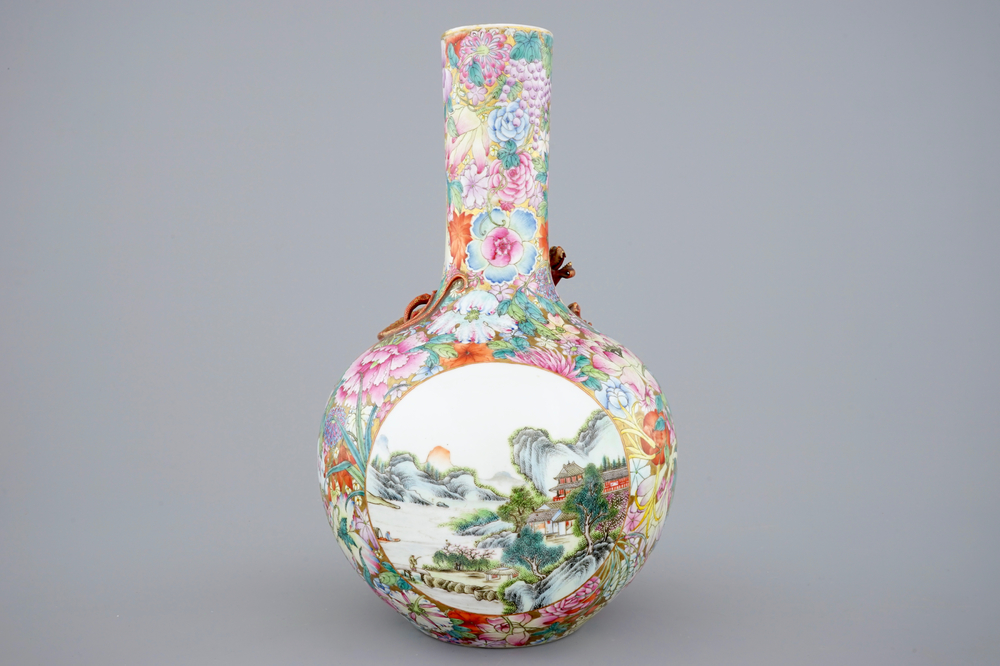 A Chinese famille rose millefleurs bottle vase with an applied dragon and landscape panels, 19/20th C.