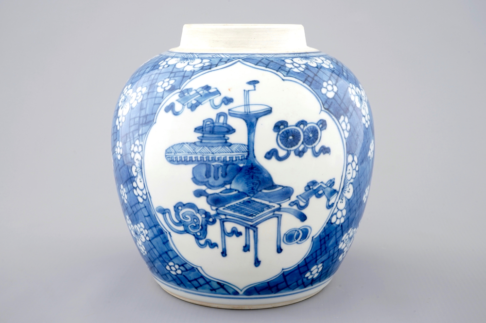 A Chinese blue and white ginger jar with precious objects, Kangxi