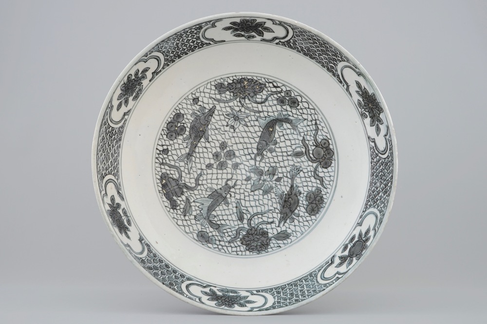 A Chinese Swatow dish with a blue-grey design of fish, Ming Dynasty, 16/17th C.