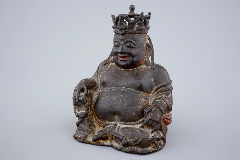 A Chinese gilt and lacquered bronze figure of crowned laughing Buddha, Ming Dynasty