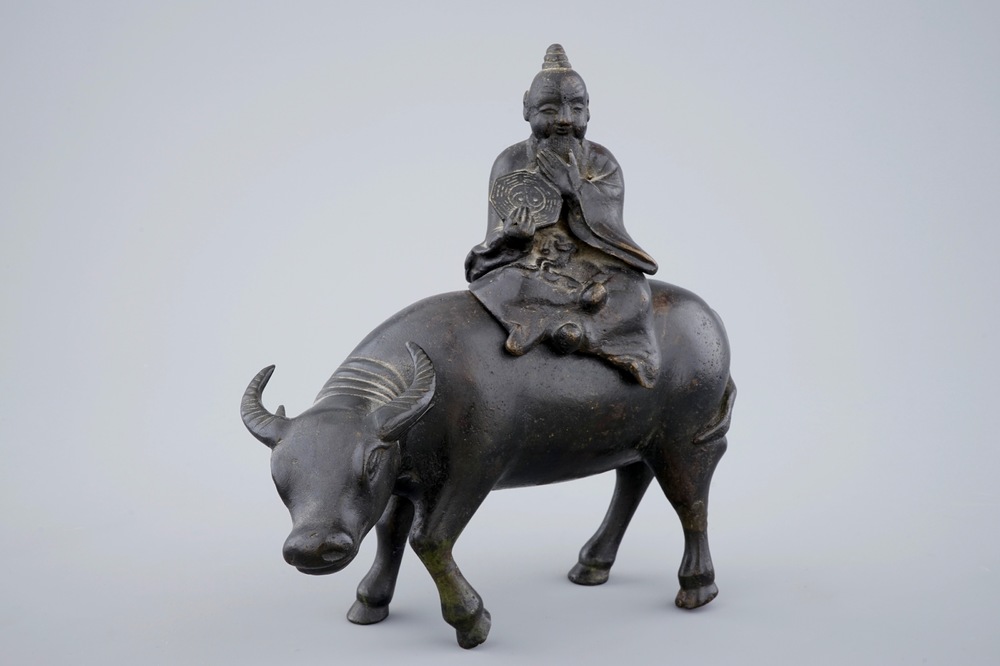 A Chinese bronze incense burner in the shape of a sage riding a buffalo, 19th C.