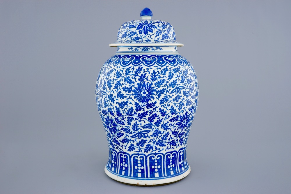 A Chinese blue and white vase and cover with lotus scrolls, 19th C.