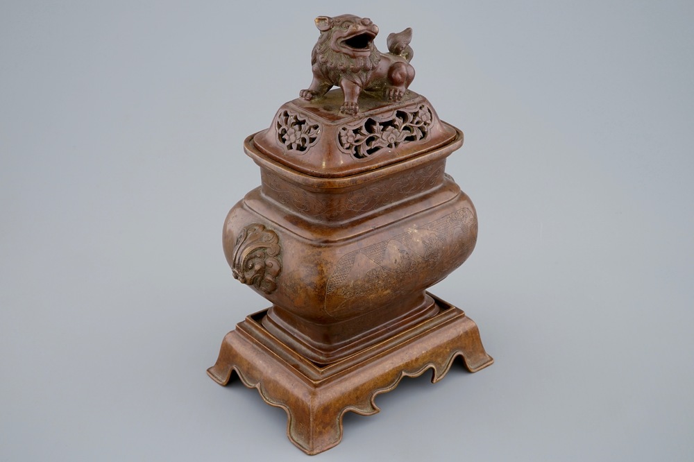 A Chinese bronze censer on stand with engraved design, 18/19th C.