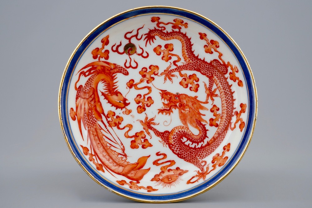A Chinese iron red dragon and phoenix plate, Guangxu mark and poss. of the period