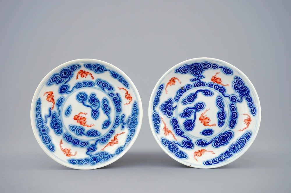 A pair of Chinese blue, white and iron red plates with bats among clouds, Guangxu mark and of the period
