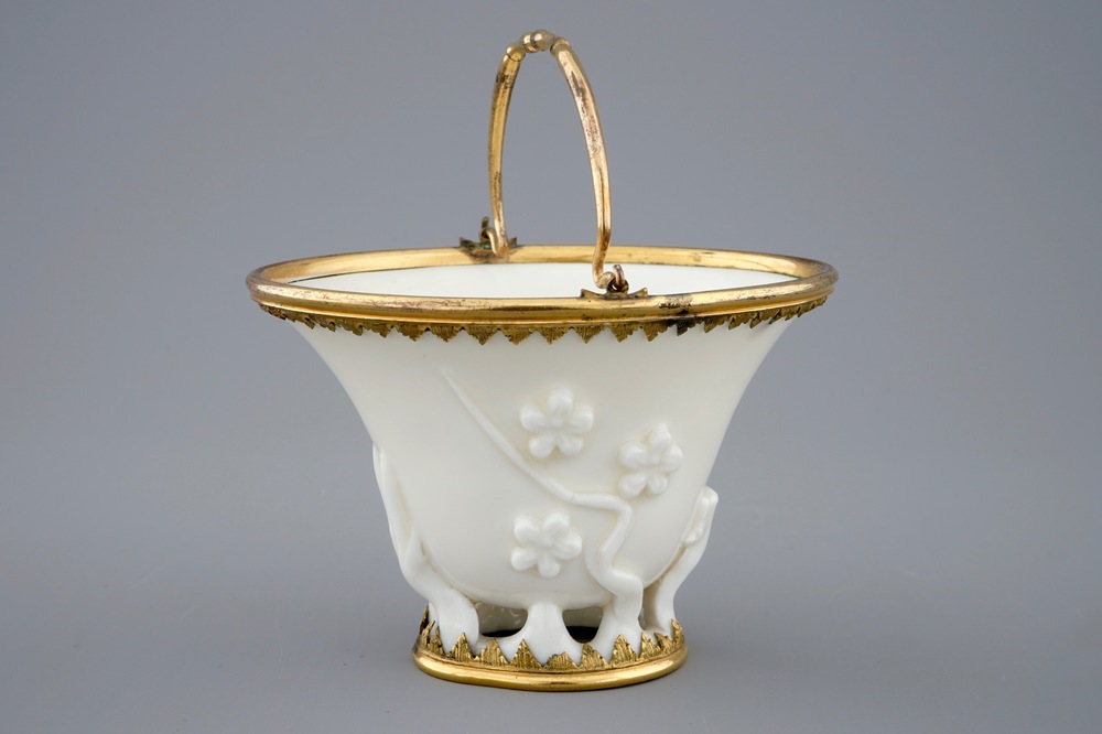 A Chinese blanc de Chine libation cup with gilt bronze mounts, Kangxi