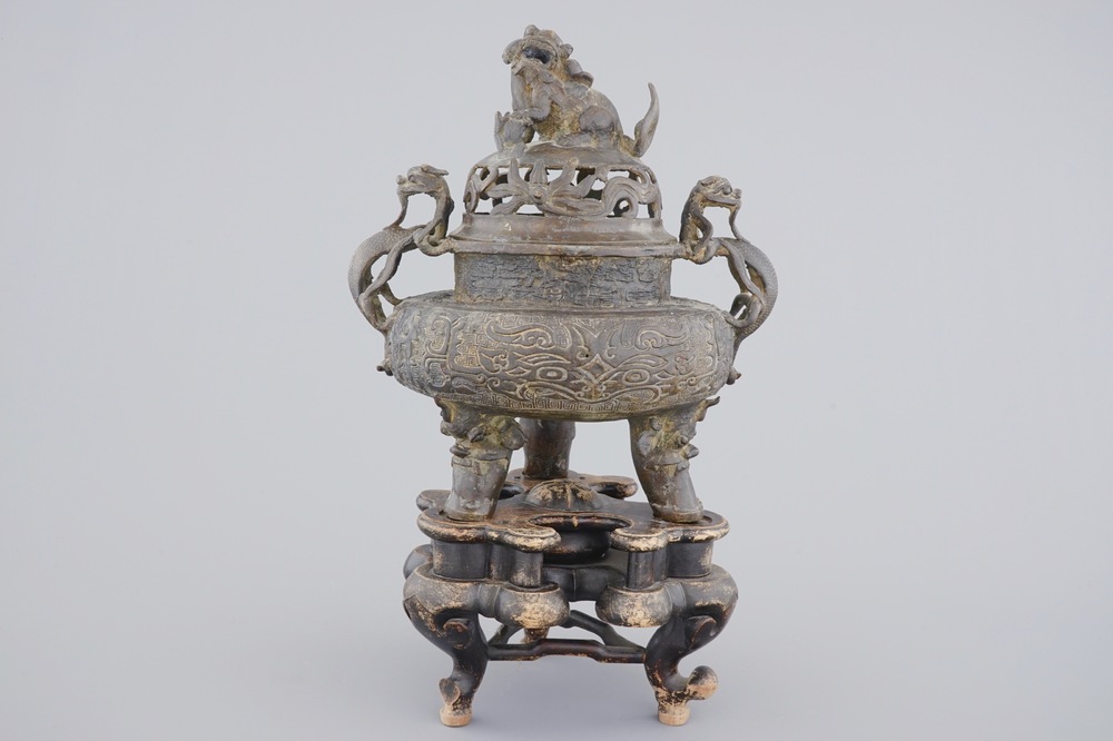 A large Chinese bronze tripod censer on stand, 17/18th C.