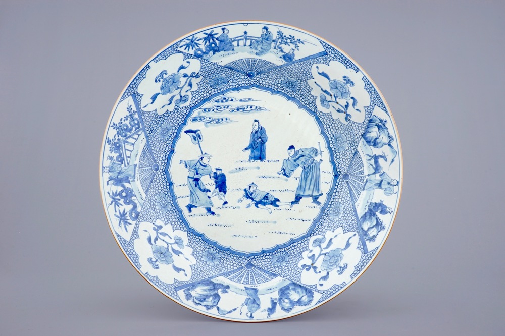 A massive blue and white Chinese charger with a punishment scene, Yongzheng/Qianlong