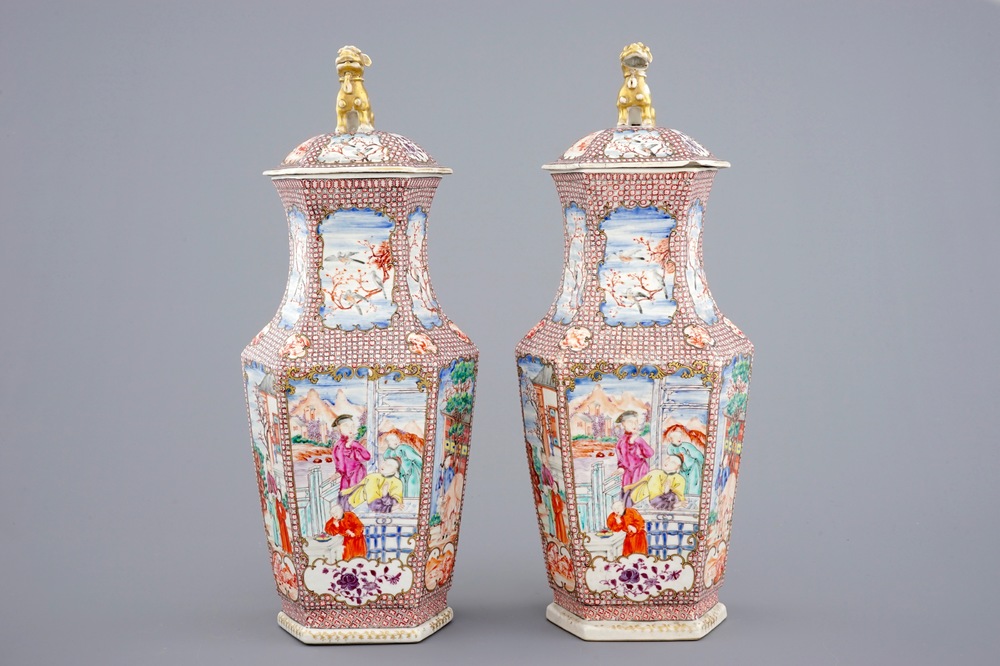 A pair of hexagonal Chinese famille rose mandarin vases and covers, Qianlong, 18th C.