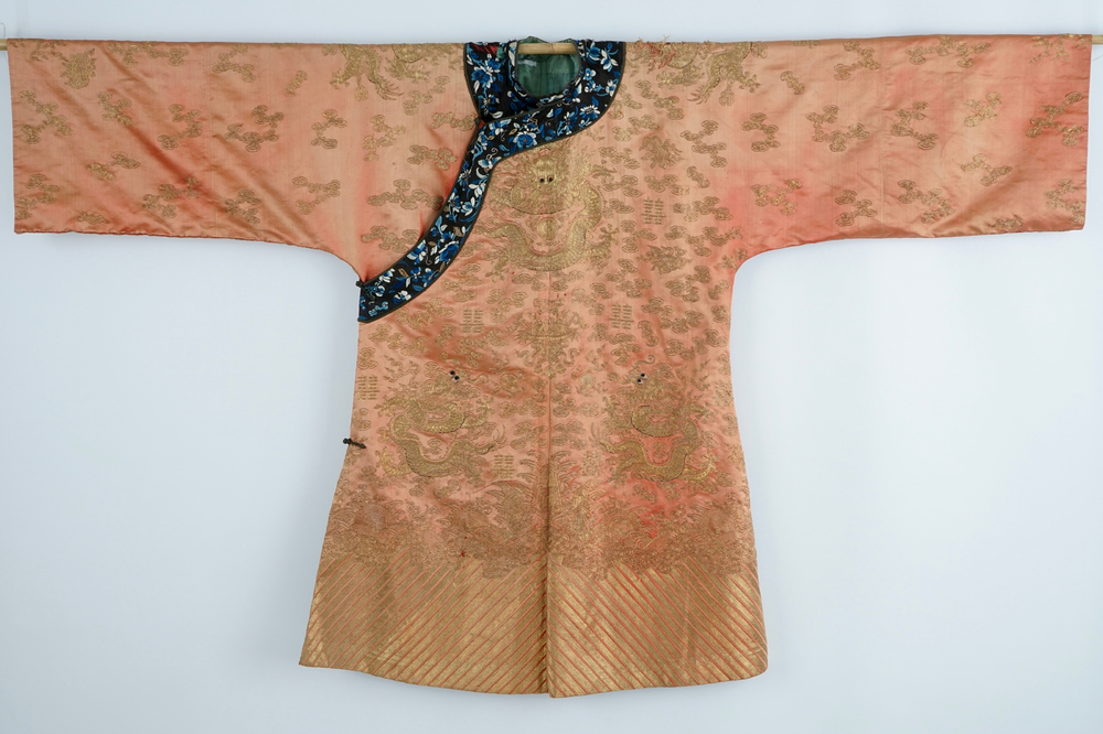 A Chinese orange ground silk embroidered dragon robe, 19th C.