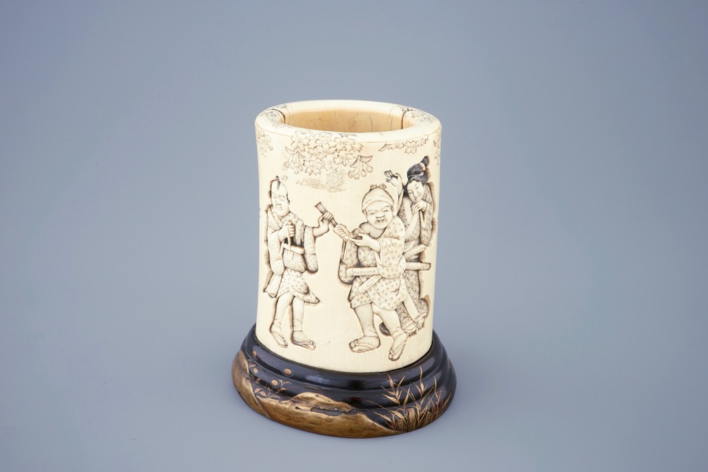 A Japanese carved and signed ivory brushpot on gilt-lacquered stand, Meiji, 19th C.