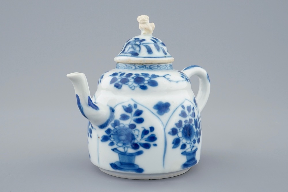 A blue and white Chinese lotus shape moulded teapot and cover, Kangxi