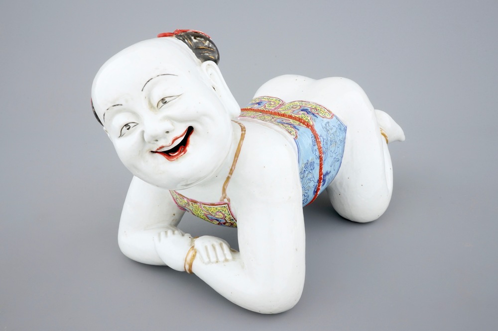 A large Chinese porcelain pillow in the form of a kneeling boy, 18th C.