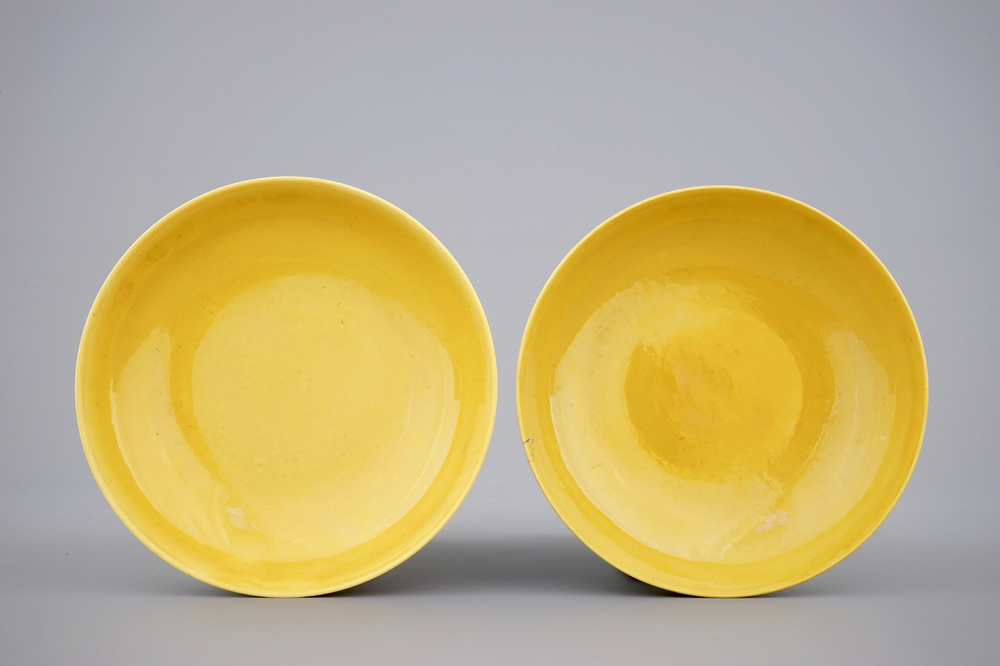 A pair of Chinese yellow glazed saucer dishes with incised backs, Qianlong sealmark and poss. of the period