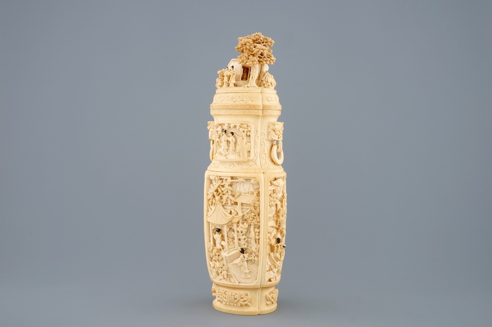 A very fine Chinese carved ivory vase and cover with figures in a landscape, ca. 1900