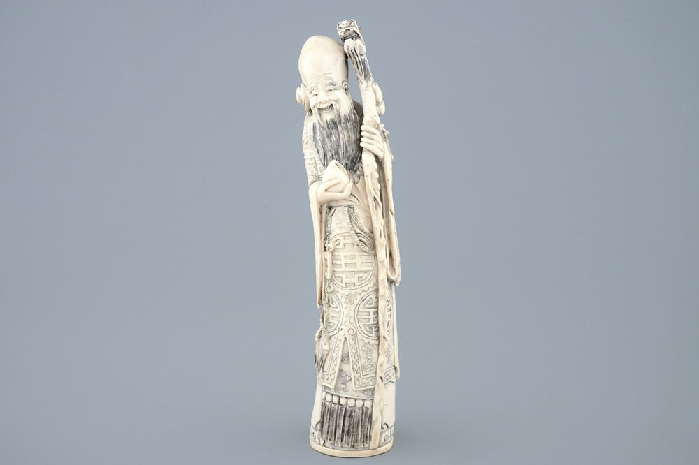 A tall Chinese carved ivory figure of Shou Lao, late 19th C.