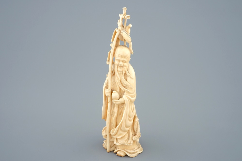 A Chinese carved ivory figure of Shou Lao, late 19th C.