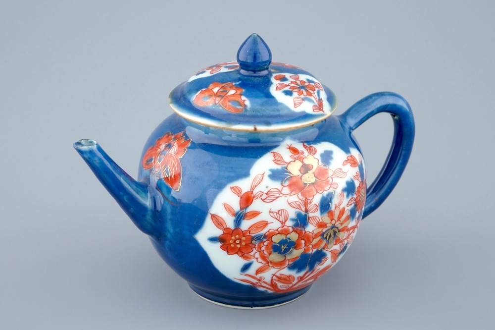 A Chinese powder blue and iron red decorated teapot and cover, Kangxi