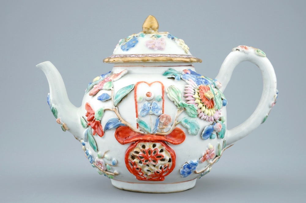 A Chinese relief-decorated famille rose teapot and cover, Yongzheng, 1723-1735